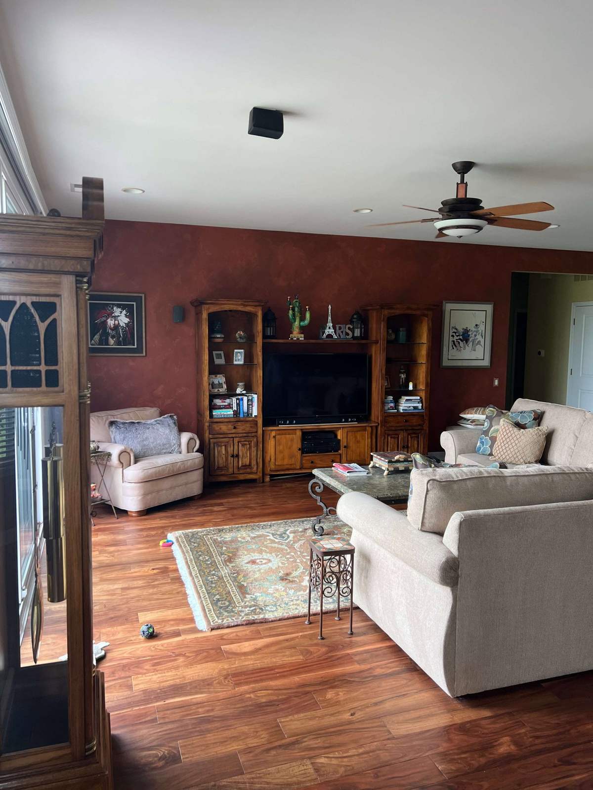 Living room before remodeling with red accent wall