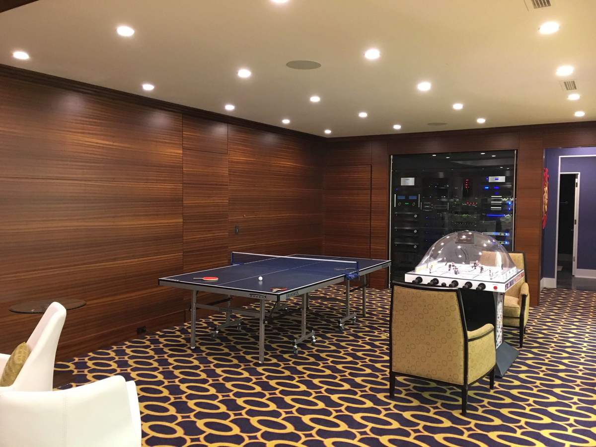Basement dining area with wood wall panels
