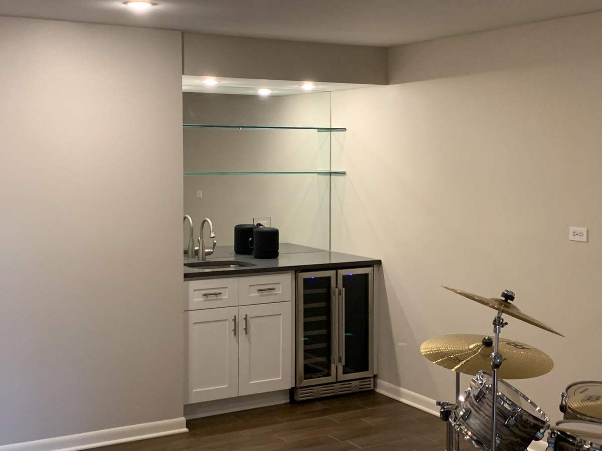 Beverage station with glass shelves and undercounter fridge