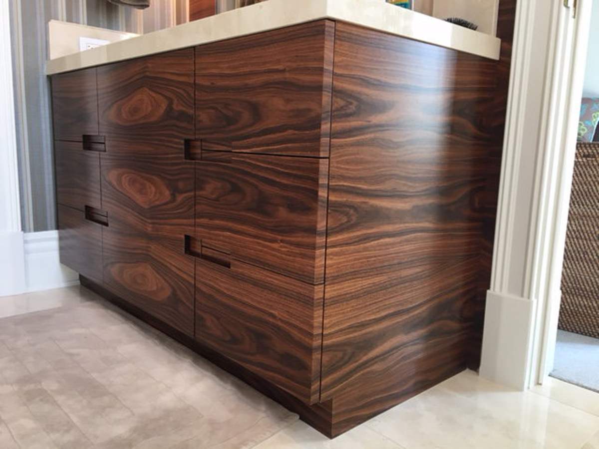 Wood-grain bathroom vanity with wide drawers
