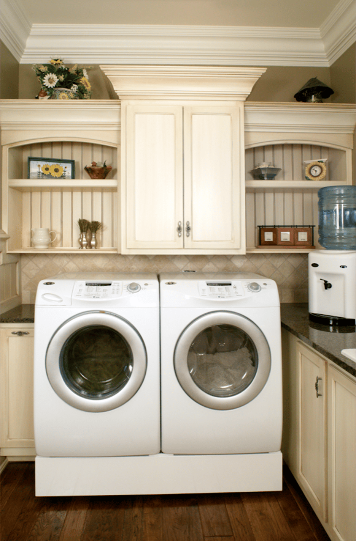 Laundry area with cabinets around front-loading machines