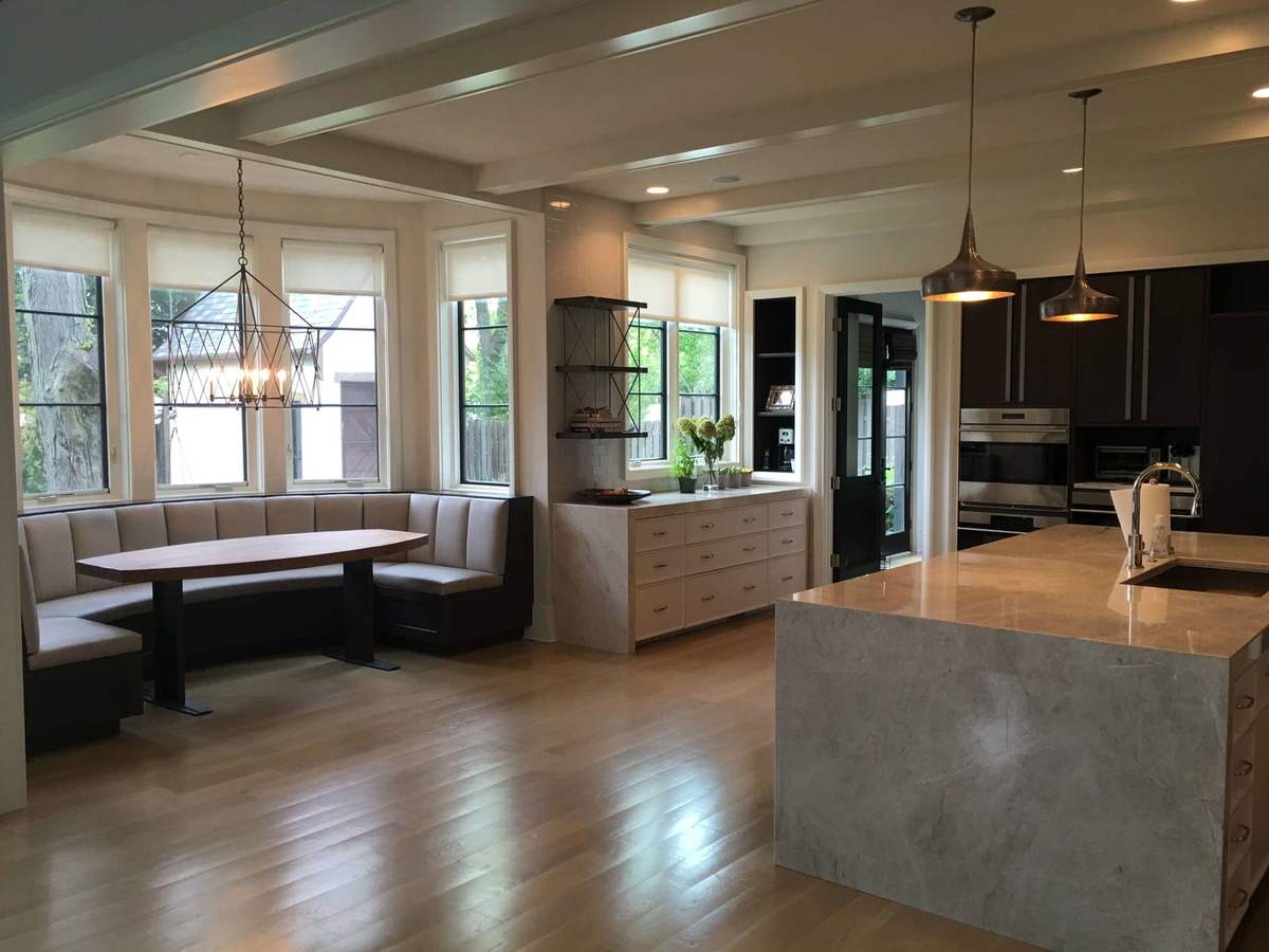 Kitchen with stone island and built-in window seating